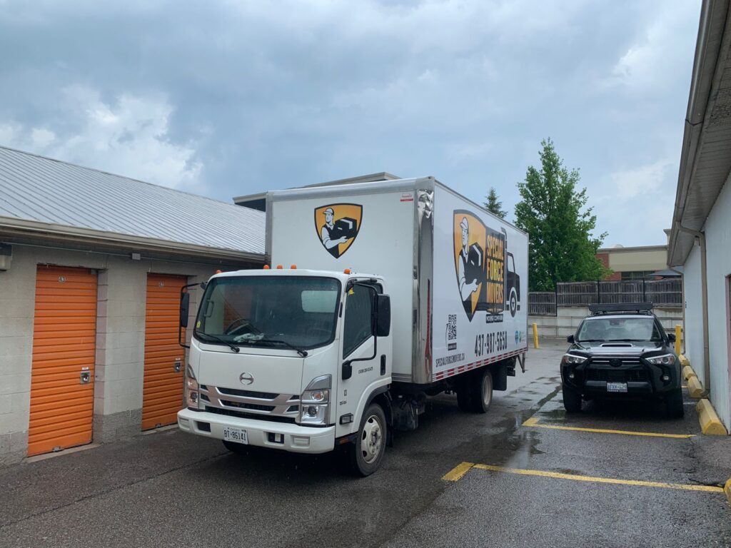 Special Force Movers truck parked outside a storage facility