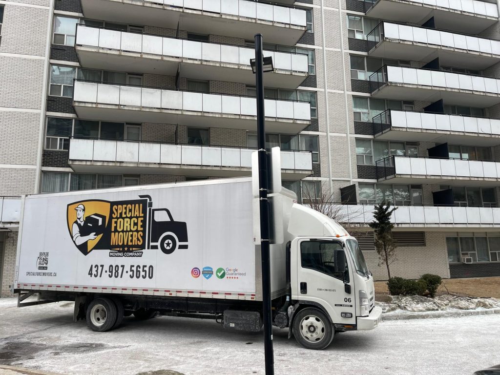 Special Force Movers truck parked outside an apartment building in Ontario