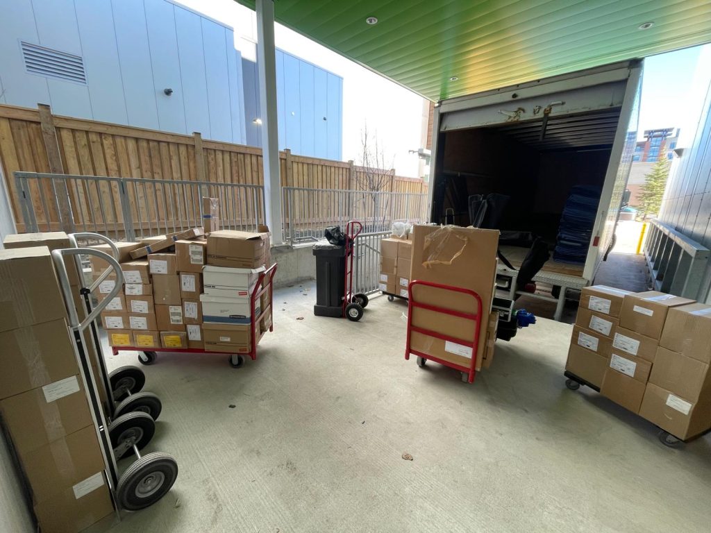 Moving boxes being loaded into a truck in Ontario