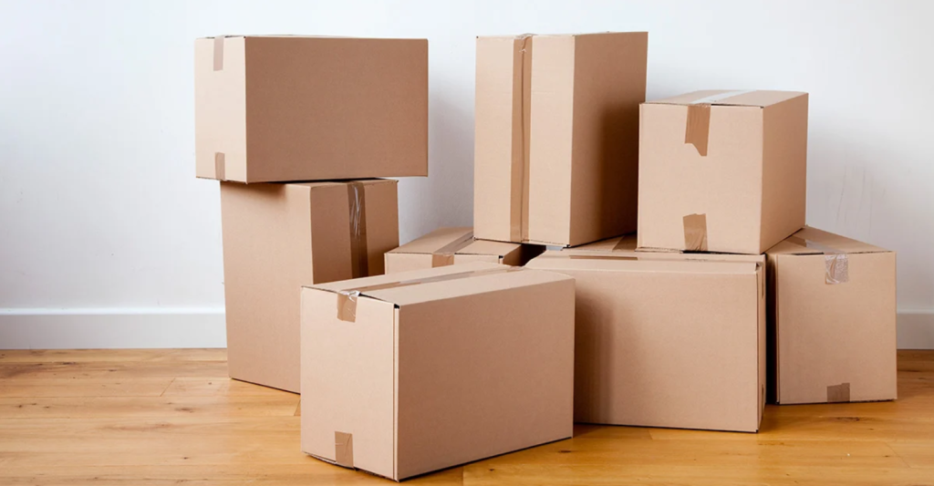 Packing boxes and preparing household items for a move in Ontario